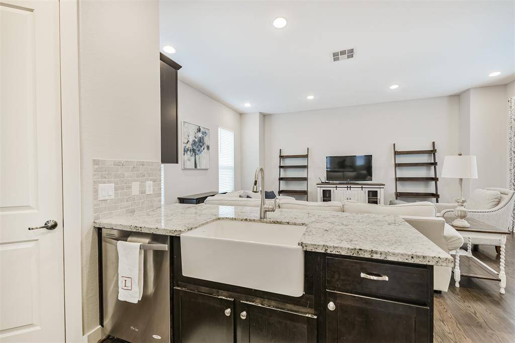 Deep single basin Farmhouse sink is a feature. The pantry is the door to the left.