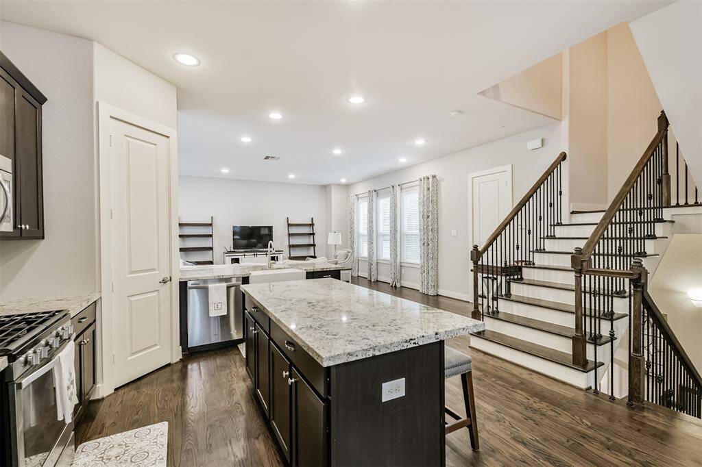 Light and bright while not being ALL white. The dark wood tones are a lovely contrast in this modern home. Let's go upstairs!