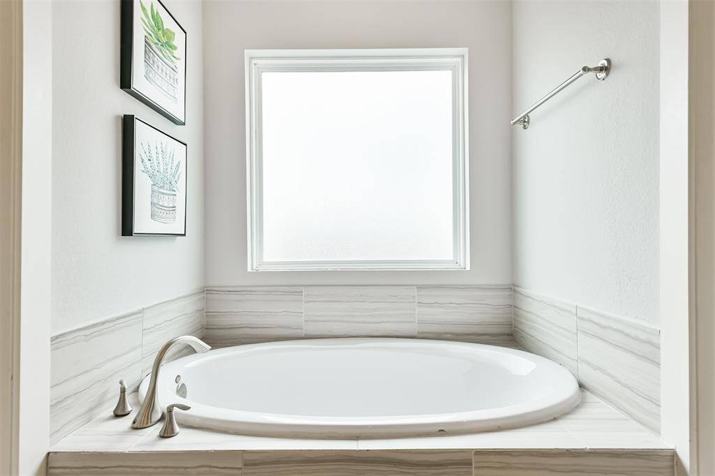 Ahh - unwind after a long day in your soaking tub off the primary.