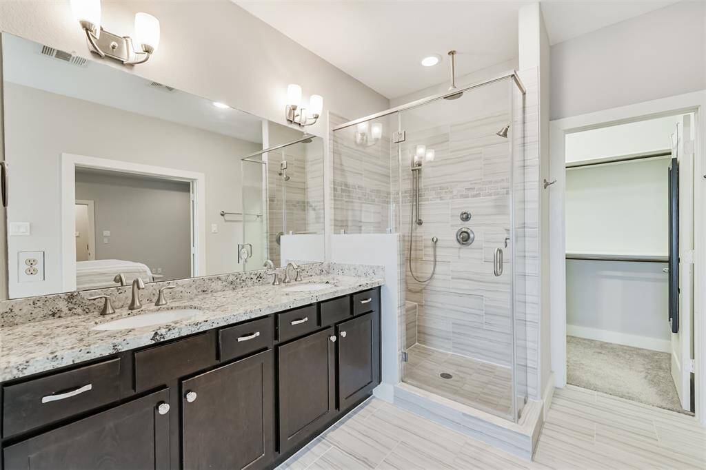 Fully tiled shower with a rain head, handheld, and regular head gives you options depending on if it's hair wash day or not!