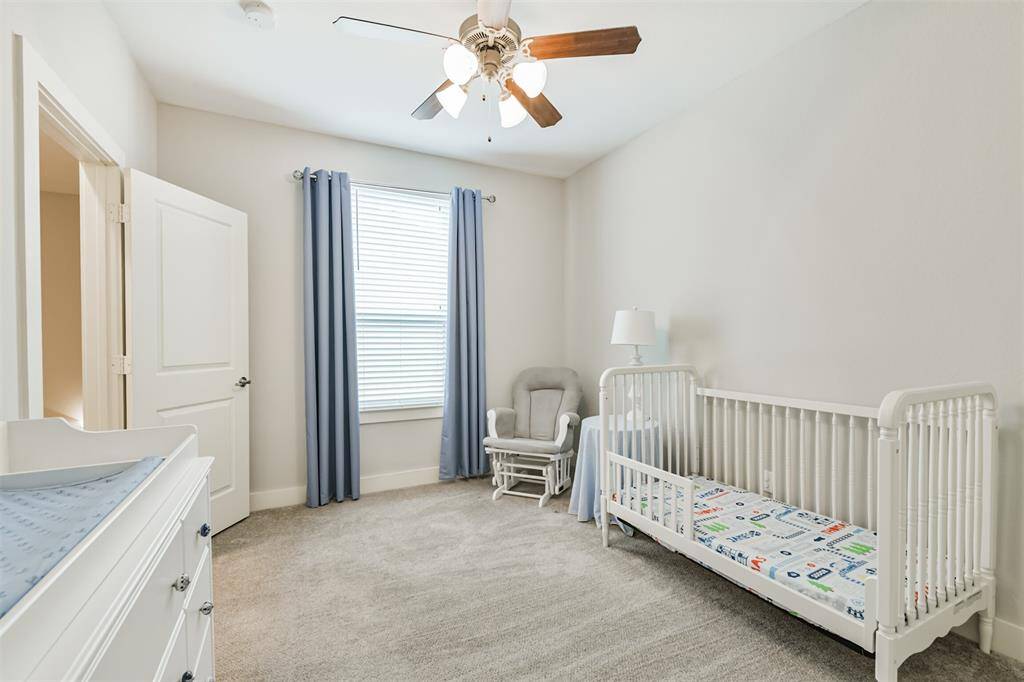 Secondary bedroom on the third floor is a great child's room, guest room, or additional office.