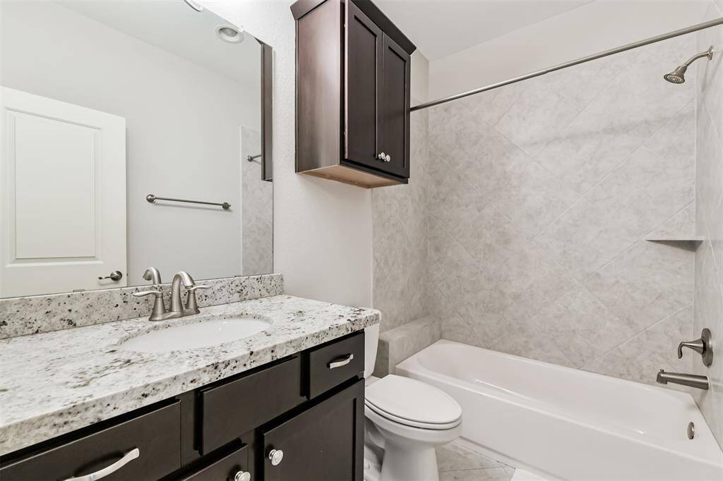 En suite full bathroom on the third floor.