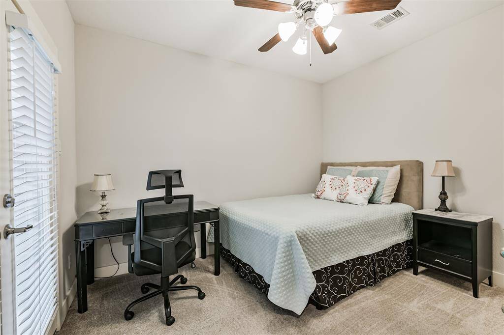 First floor bedroom with French doors to small back patio.