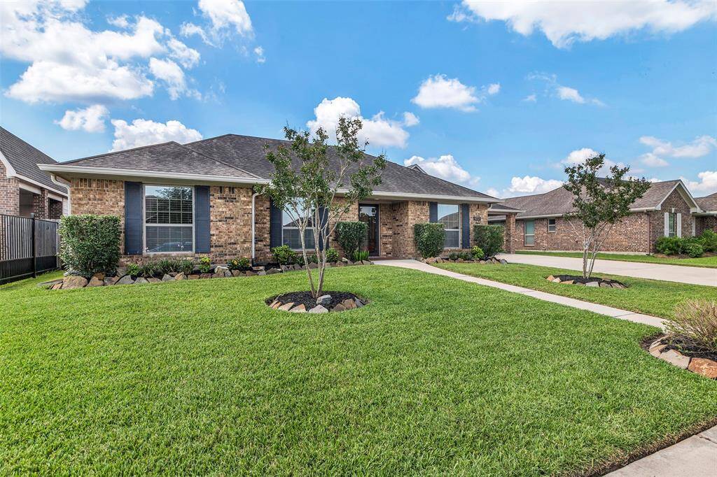 Beautiful landscaping welcomes you to this charming one story home.