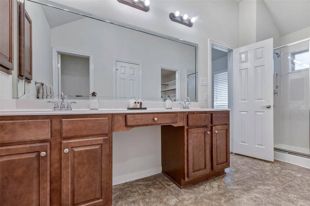 Primary bathroom with double sinks and shower.