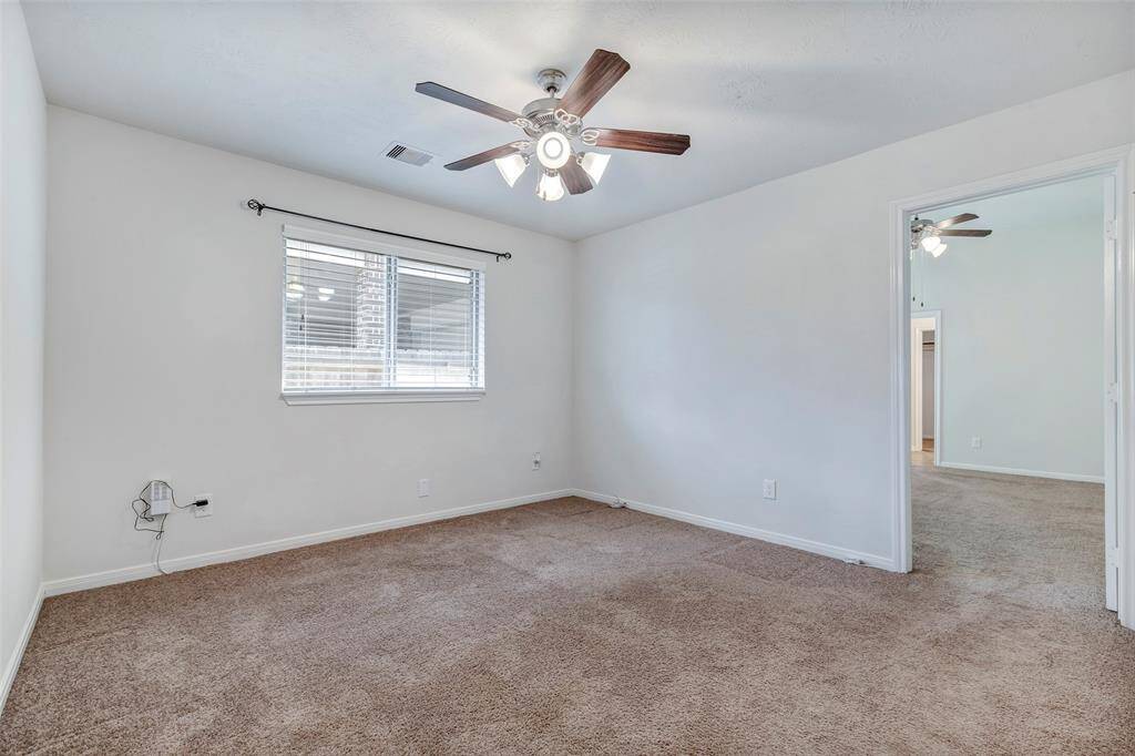2nd bedroom is adjacent to the primary bedroom. Perfect for a nursery or sitting area. The door can be closed up. The original floorplan design had a door in the primary bedroom that was closed up.