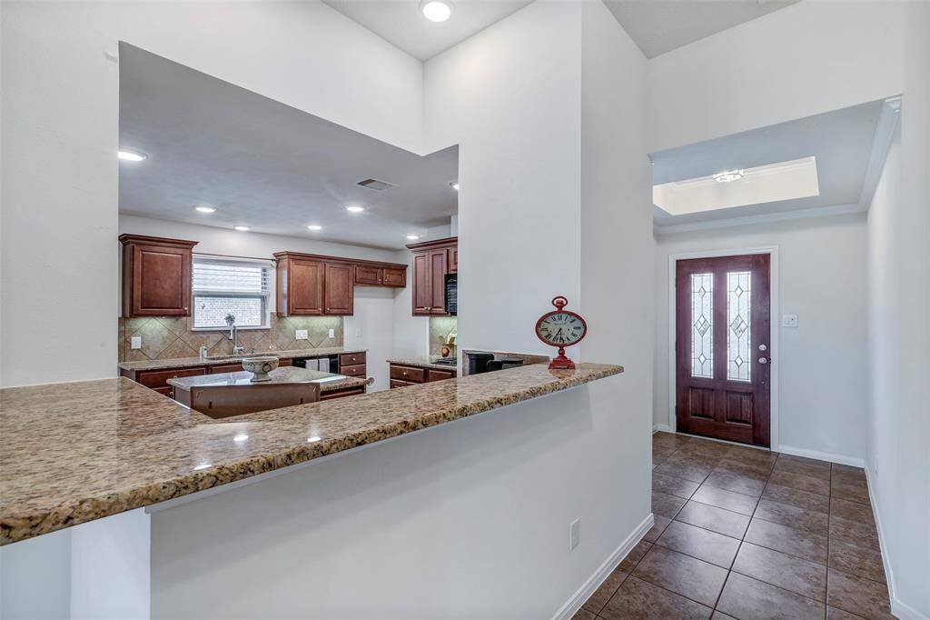 Upon entering the home you will have find a spacious hallway that leads you to the kitchen.