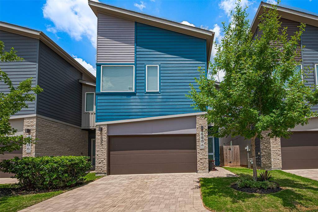 Welcome to 6804 Rocinante Ln. A Modern curb appeal meets low-maintenance living—this stylish, gated-community home features a bold façade, private 2-car garage, and lush landscaping, all nestled on a quiet street minutes from the heart of Houston.