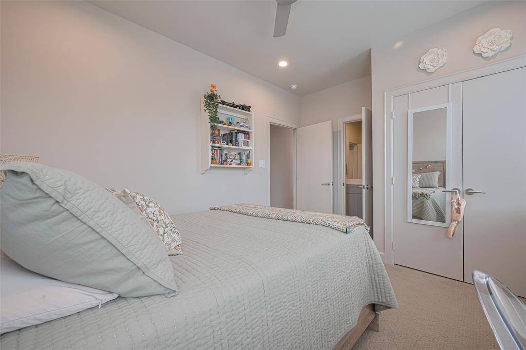 Comfortable and bright, this secondary bedroom offers ample space, recessed lighting, a ceiling fan, and dual-door closet—perfect for guests, a home office, or a stylish retreat.