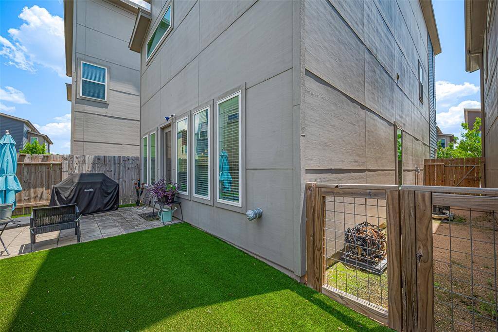 Enjoy a private, pet-friendly backyard with low-maintenance turf, a separate gated side space, and patio access—ideal for grilling, gardening, or letting your furry friends roam freely.