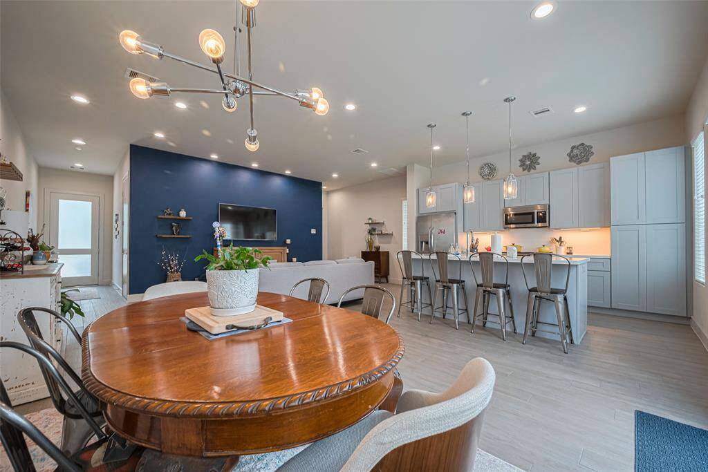 A perfect blend of function and flow—this open-concept layout connects dining, living, and a chef-inspired kitchen, ideal for entertaining or everyday ease in modern living.