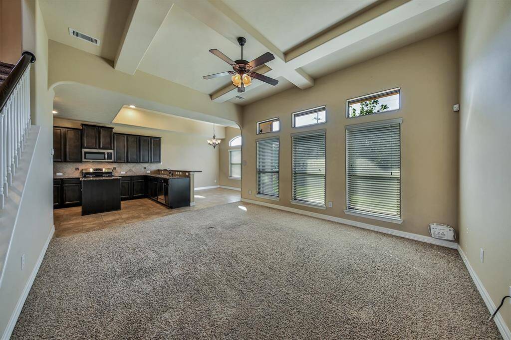 Natural light fills this room from the large windows and transom windows.