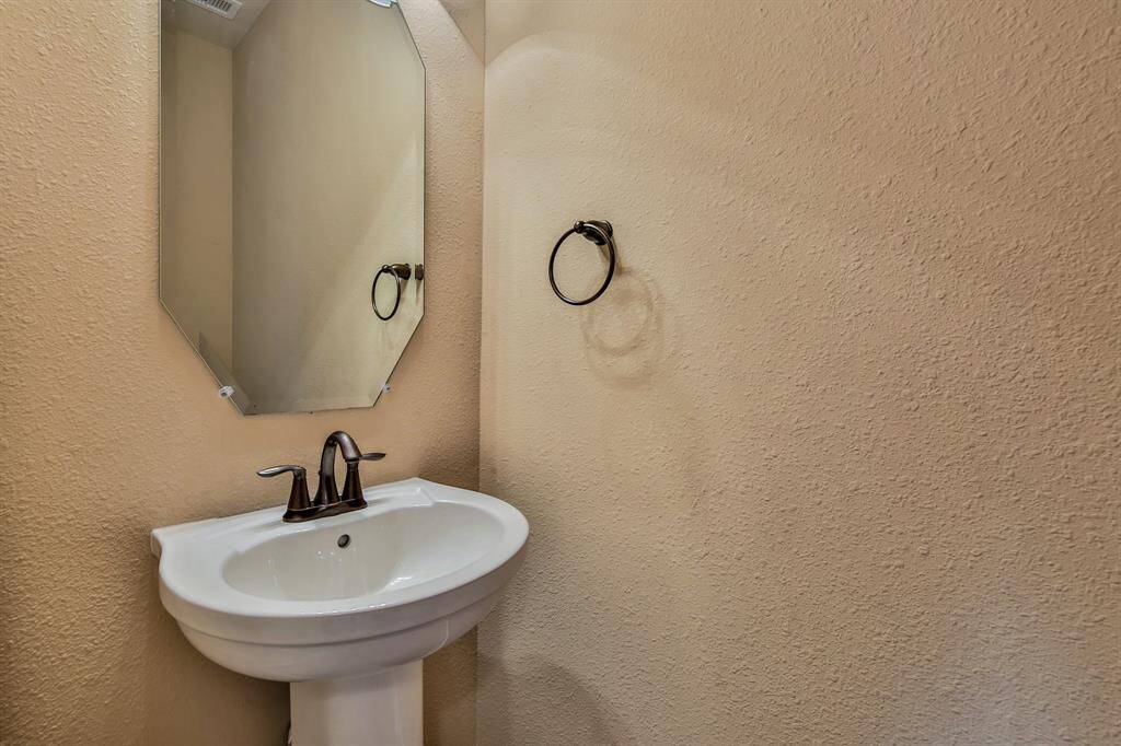 Convenient half bath is located downstairs for guests.