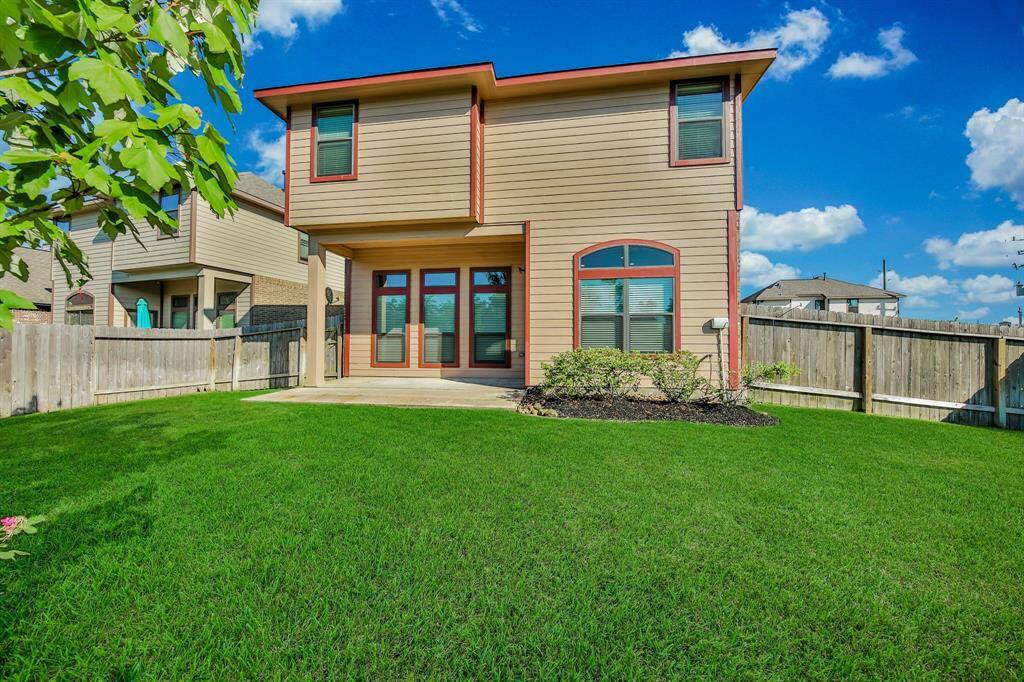 Fully landscaped front and back with full sprinklers for easy maintenance.