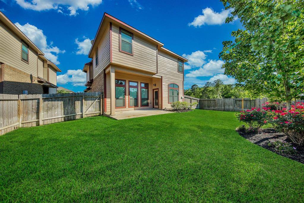 There is plenty of room for the kids to play in this private, fully fenced backyard.