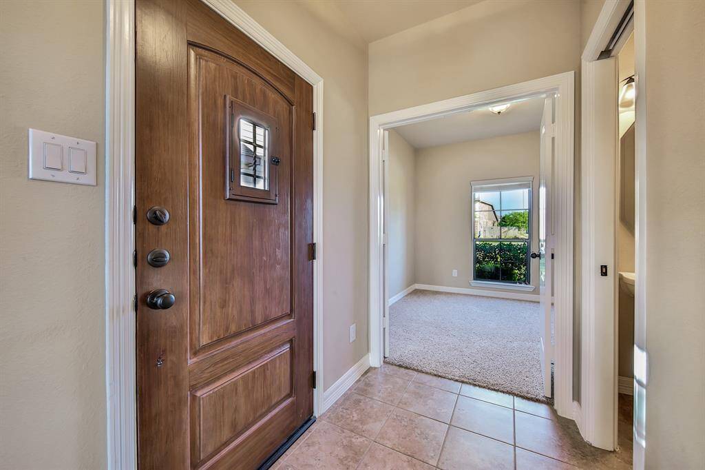 Step inside through the beautiful wooden door. This functional layout makes good use of all spaces.