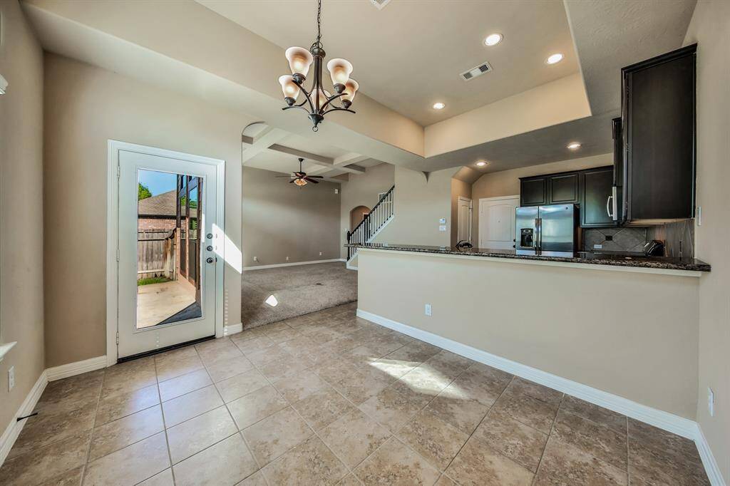 The breakfast area is spacious and bright for easy dining with your family. There's a convenient serving bar or add your stools for extra seating.