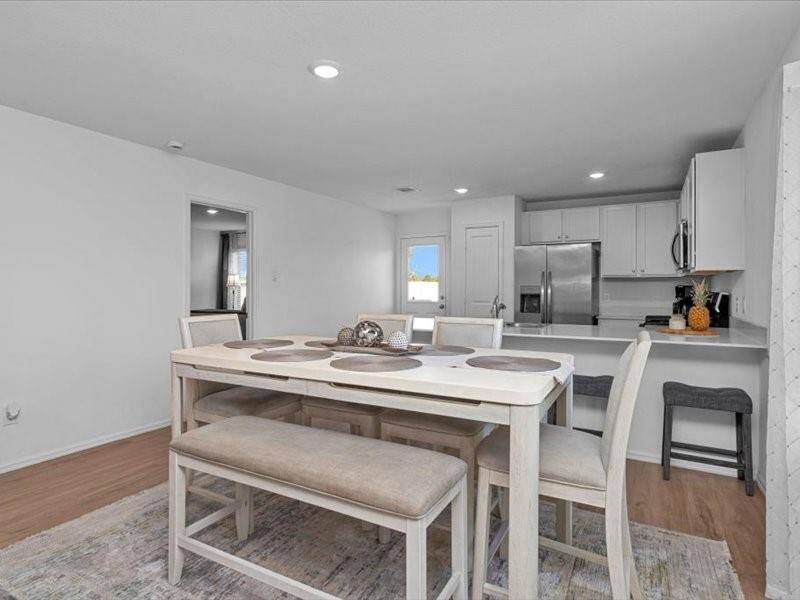 Just off the kitchen, you'll find a spacious dining room — the perfect spot for family meals or entertaining guests