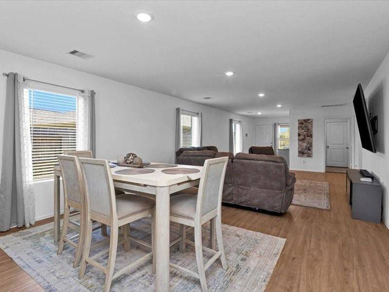 From the kitchen, enjoy another perspective looking out toward the front of the home, where natural light pours in and creates an inviting, open atmosphere.