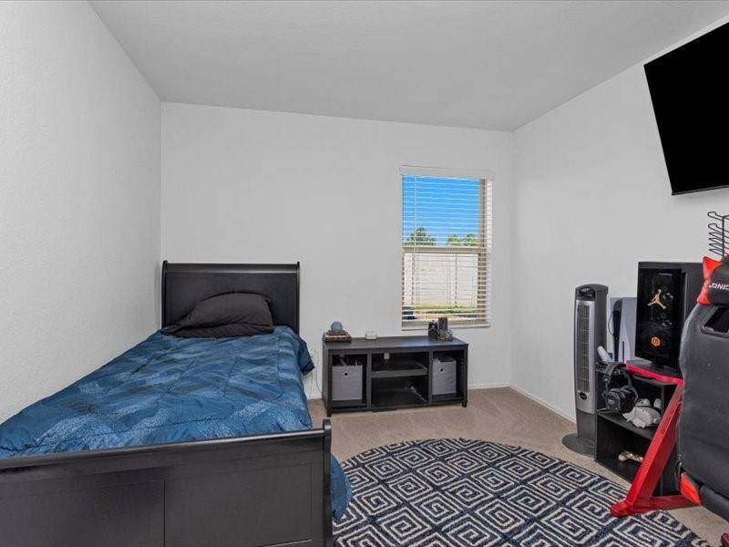 Secondary Bedroom 2 is a comfortable and flexible space, offering ample room to suit your needs—whether as a guest room, a home office, or a personal retreat.