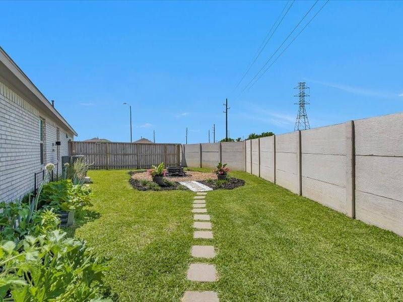Another lovely area to relax and unwind, perfect for checking on your garden or simply enjoying the peaceful outdoor setting.