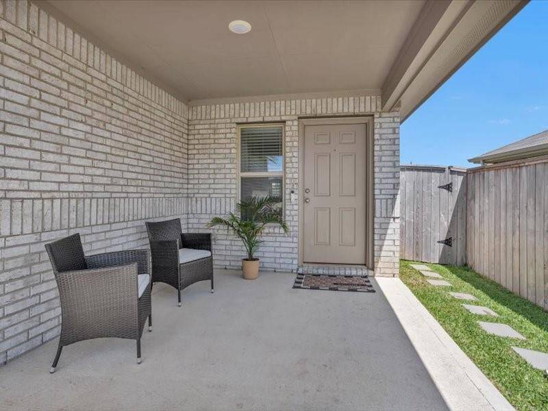 As you make your way to the front door, take a moment to enjoy the charming front porch — perfect for relaxing with a morning coffee or greeting neighbors with a smile.