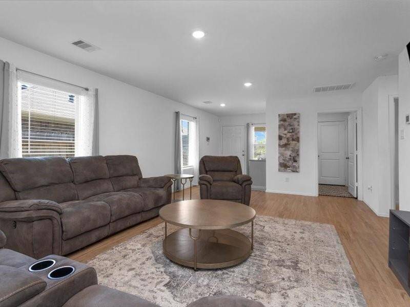 Here's another look at the family room — spacious, full of light, and perfect for making memories with family and friends.