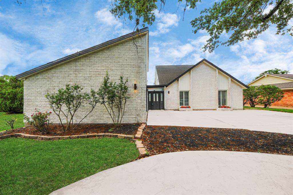 Welcome Home to 722 Merrick Dr. This beautifully updated home boasts striking curb appeal with freshly painted white brick, sleek black double doors, and manicured landscaping.