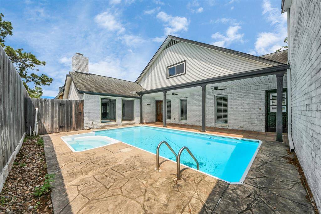 Enjoy year-round relaxation and entertaining in your own private courtyard-style backyard featuring a sparkling pool and spa, surrounded by an extended covered patio.