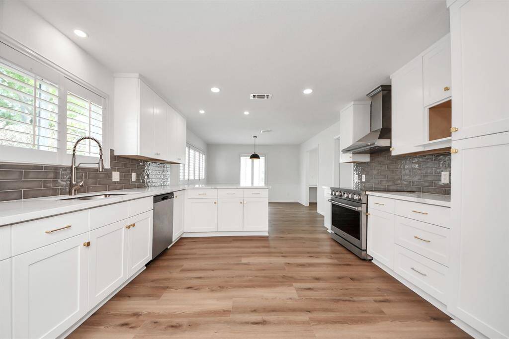 This open-concept kitchen seamlessly blends style and function, bathed in natural light, the space flows effortlessly into the breakfast area—perfect for everyday living and entertaining.