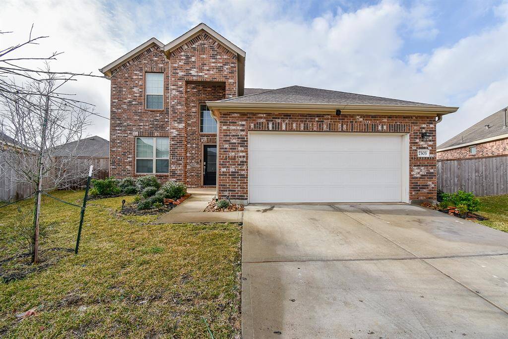 Discover this stunning two-story brick home, featuring elegant windows that flood the space with natural light.