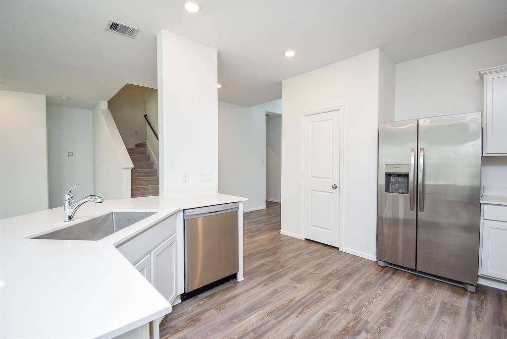 Discover a bright, spacious kitchen ready for your personal touch.