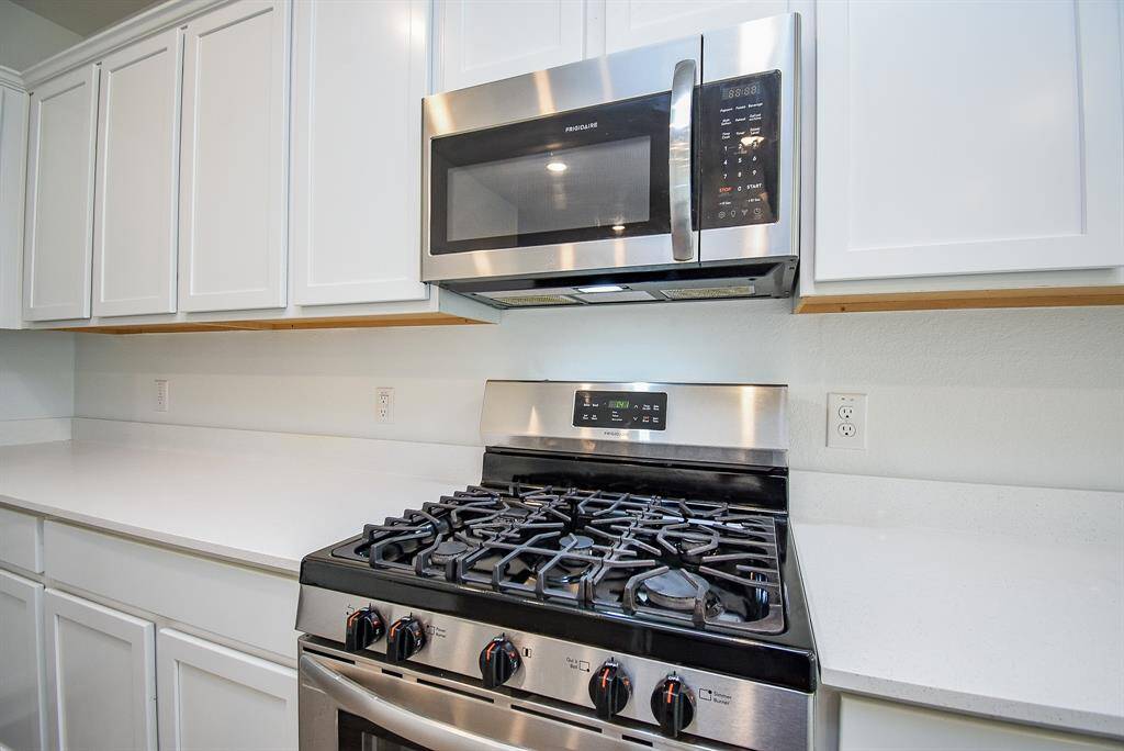 Featuring sleek stainless steel appliances for a modern touch.