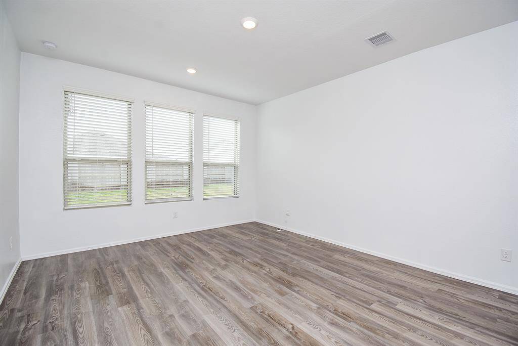 Discover the expansive primary bedroom, a bright and serene retreat.