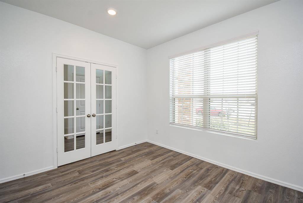 Cozy and private multi-purpose room, perfect for an office, study, or sunroom retreat.