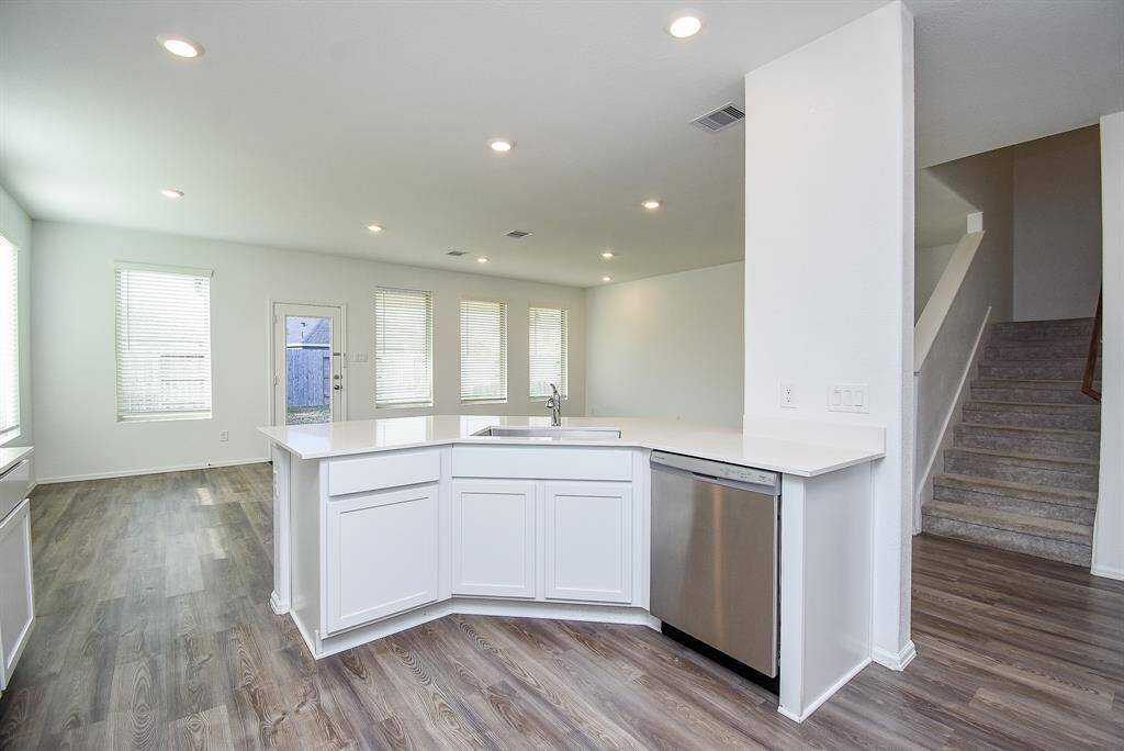 Enjoy a panoramic view of the entire room from the kitchen.