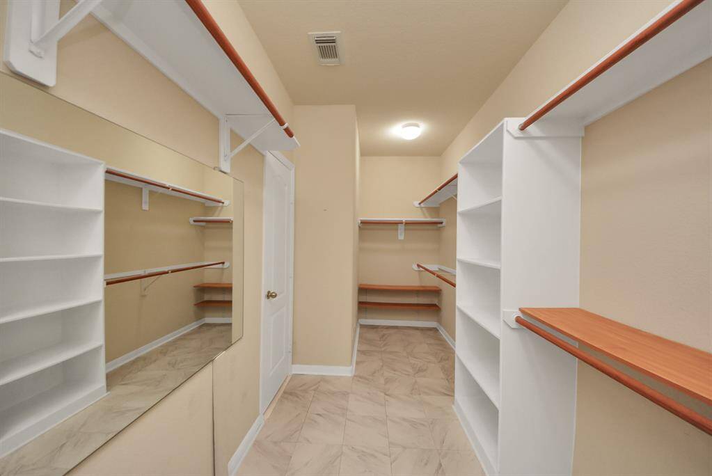 Huge primary closet for all your clothes and accessories