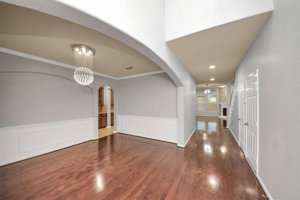 Greeted by the formal dining room as you enter