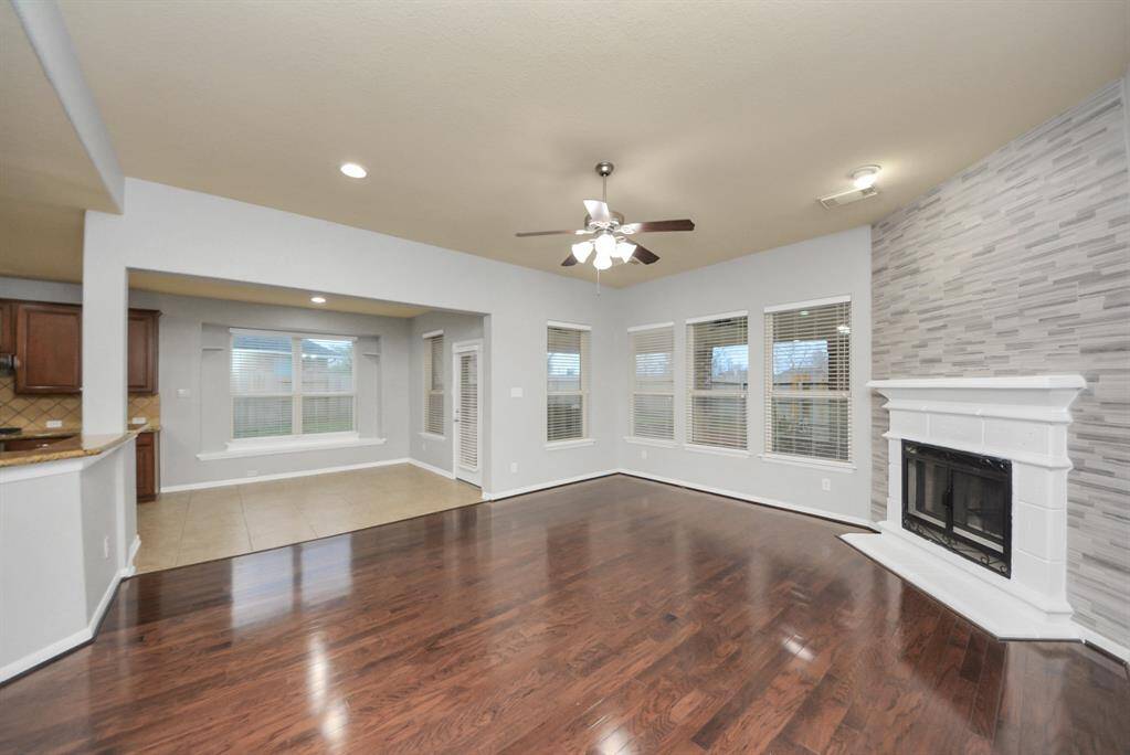 As you pass the dining room, you are greeted by the family room