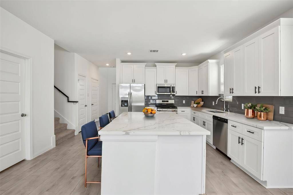 The convenience of the stainless steel appliances, ready for all your cooking endeavors.