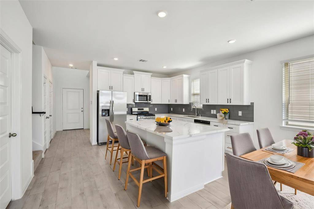 The stylish flooring and neutral tones create a sophisticated and inviting atmosphere.
