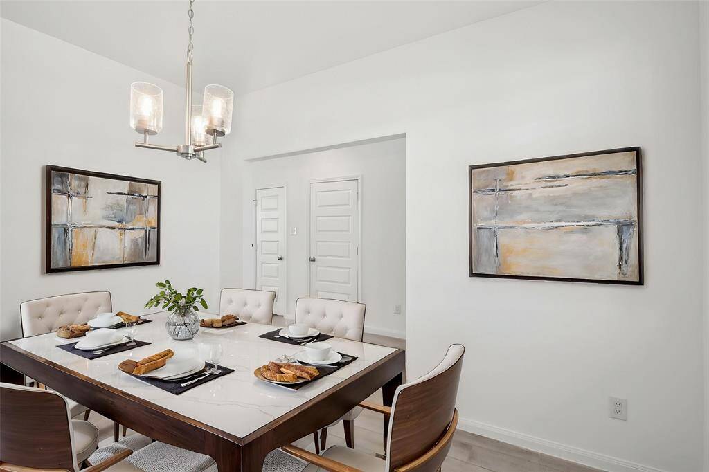Envision the joy of creating lasting memories in this beautiful dining room, designed for both comfort and sophistication.