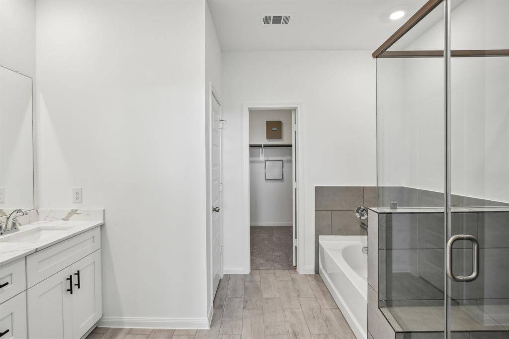With its clean lines and thoughtful design, the bathroom is more than just a functional space, its a private oasis.