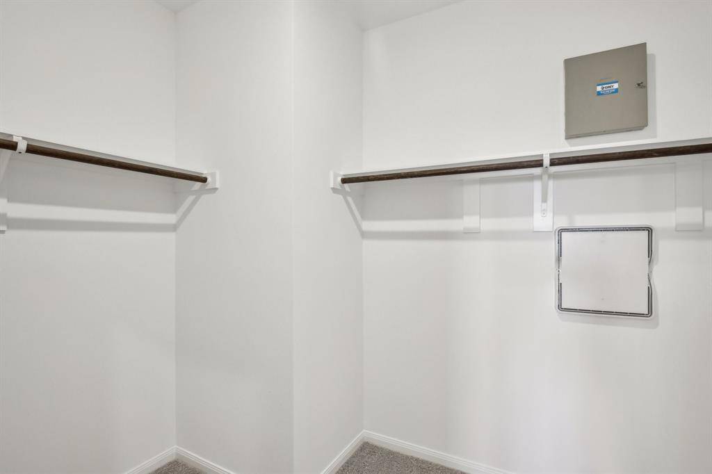 Discover this spacious primary closet.