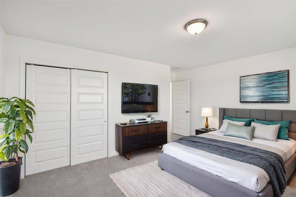 The next bedroom features sliding closet doors for easy access.