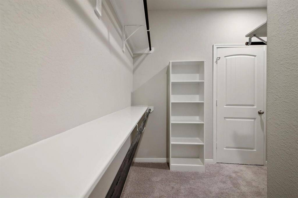 This walk-in closet is perfect for organization.
