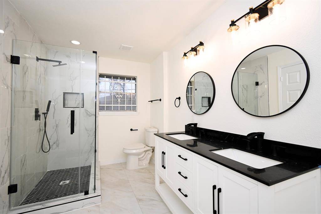 New Standing shower w/Glass doors, New mirrors, New light fixtures, New granite countertop Double Vanity & Cabinets