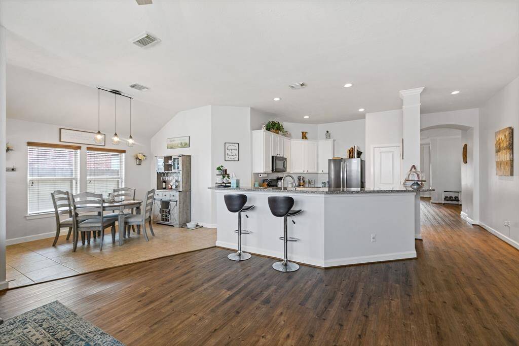 Cozy breakfast area conveniently situated off the kitchen with a convenient breakfast  bar for quick meals.