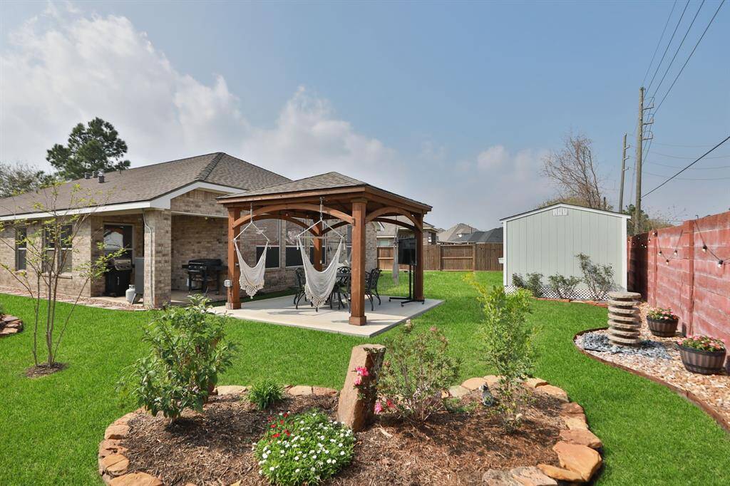 This back yard is beautifully landscaped and maintained.