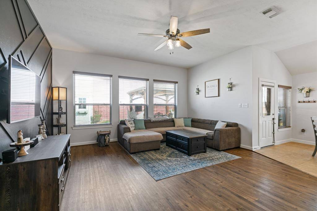 Bright and inviting family room with ample natural light, perfect for relaxation and gatherings.